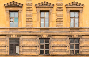 Several windows in a row on facade of the Saint-Petersburg University of Economics front view, St. Petersburg, Russia