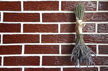 Bouquet of lavender on brick wall background
