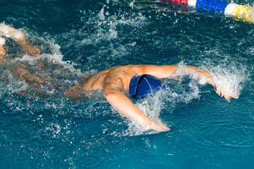 boy swimming in the pool