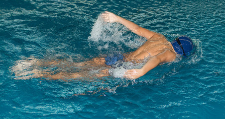 boy swimming in the pool