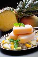 Pineapple mango sorbet ice cream popsicles.