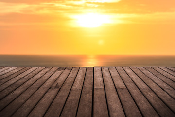 perspective empty wooden terrace with sunset on sea background