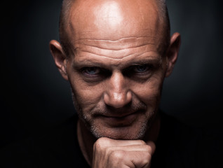 Naklejka premium studio portrait of a brutal bald man 