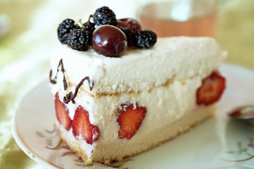 piece of cake decorated with fresh fruits