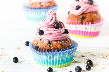 Blueberry Cupcakes decorated with whipped cream frosting