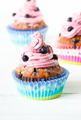 Blueberry Cupcakes decorated with whipped cream frosting