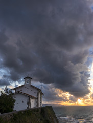 San Telmo chapel and beach of Itzurun in Zumaia at sunset. Basque Country