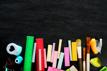 Colourful stationery on black background