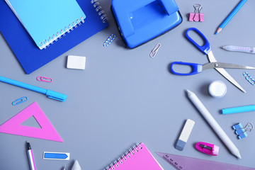 Set of stationery on grey table, top view