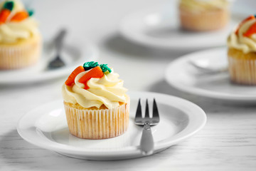 Composition with Easter cupcake on wooden background