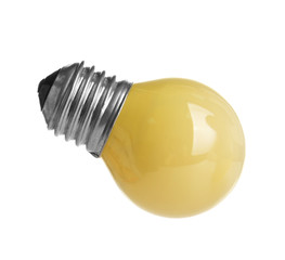 Decorative yellow light bulb, isolated on white