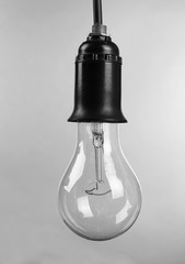 Light bulb on grey background