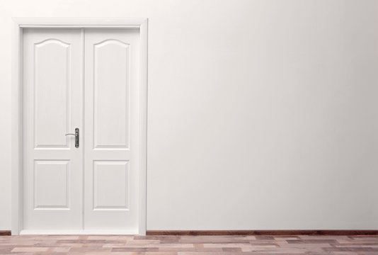 White wall and closed door indoors
