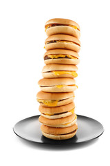 Tasty cheeseburgers on plate, isolated on white