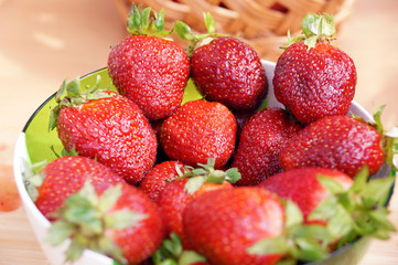 Fresh strawberry in a transparent salad bowl