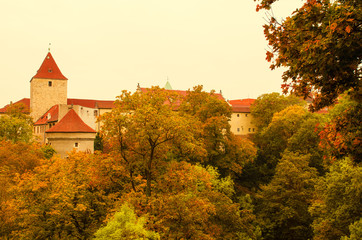 Obraz premium Prague Castle, old city with autumn trees , european travel seasonal fall background in vintage style