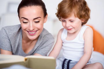 Mother and son reading a book