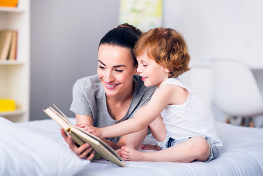 Mother and child reading a book