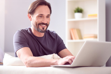Man looking at screen of laptop