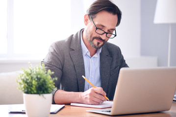 Man writing in the notebook