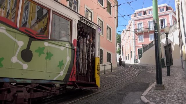 Funicular tram slowly moves uphill