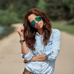 Fashion stylish young woman in sunglasses