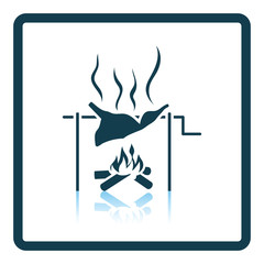 Roasting meat on fire icon