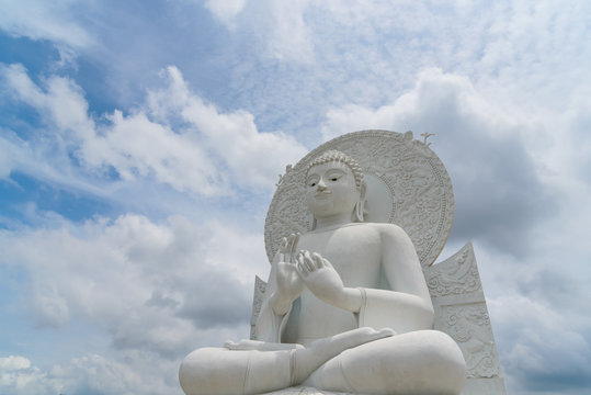 White Buddha statue - The attitude of giving the first sermon in "Sangdhamsongchevit" Spiritual Center at Saraburi, Thailand.