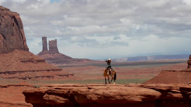 Monument Valley Young Woman Horseback Riding at John's Ford Point