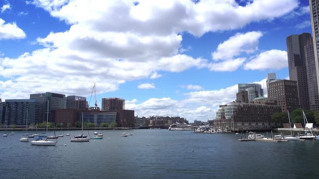 BOSTON, MA - Circa June, 2016 - A daytime establishing shot of the Boston skyline as seen from the harbor.  	