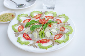 Fresh raw shrimp with seafood sauce or Shrimp in fish sauce.