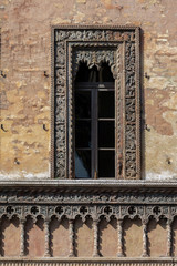 Medieval Venetian and Neo-Gothic style window of the Merchant House in Mantua, Italy