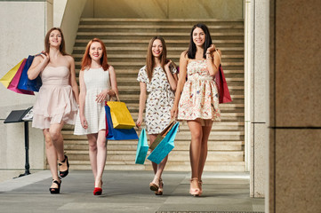 Obraz na płótnie Canvas Women friends with Shopping Bags
