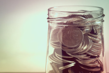 save money for investment concept money in the glass with filter