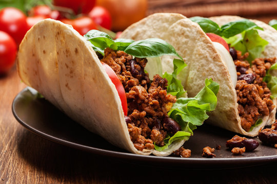 Mexican tacos with minced meat, beans and spices