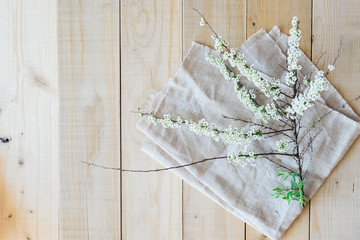 top view on wooden background blooming branch spirea