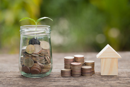  The concept of financial savings to buy a house.