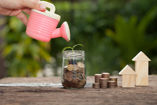  The concept of financial savings to buy a house.