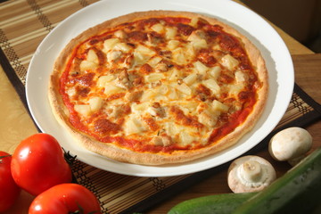 Pizza with pineapple on plate