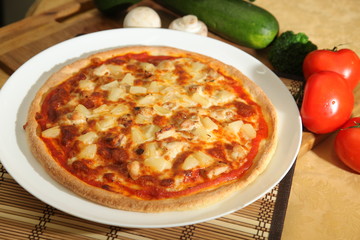 Pizza with pineapple on plate