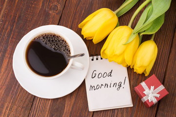 Cup of coffee, tulips and Good morning massage
