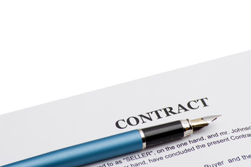 Close-up of pen on contract 