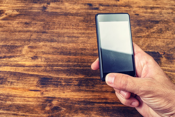 Male hand with smart phone