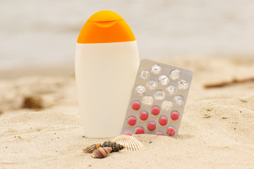 Shells, lotion and pills of vitamin E, seasonal concept