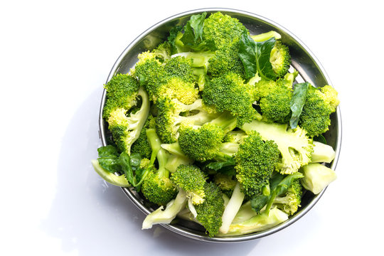 Vegetables raw food : Fresh broccoli in steel bowl isolated on white background & space for your copy text.
