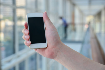 Closed up hand of man using smartphone