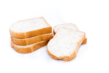 pile of whole grain bread slice isolated on white background. 
slices of soft whole wheat bread breakfast on every morning.