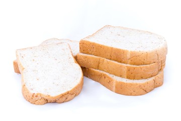 pile of whole grain bread slice isolated on white background. 
slices of soft whole wheat bread breakfast on every morning.