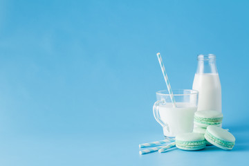 Glass of milk with french macaroon