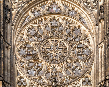 Prague, Czech Republic - May 26, 2016: Close up view of rose window at Metropolitan Cathedral of Saints Vitus, Wenceslaus and Adalbert. 